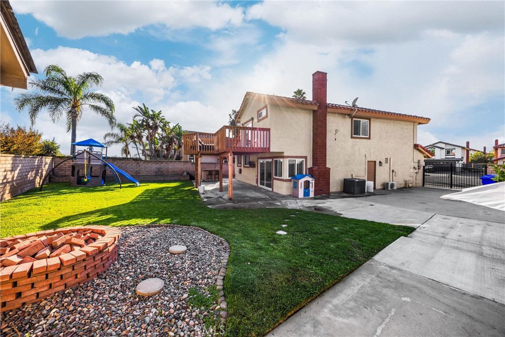 7077 Campbell Place Rancho Cucamonga, CA 91701 - Photo 44 of 74 a view of a house with a back yard