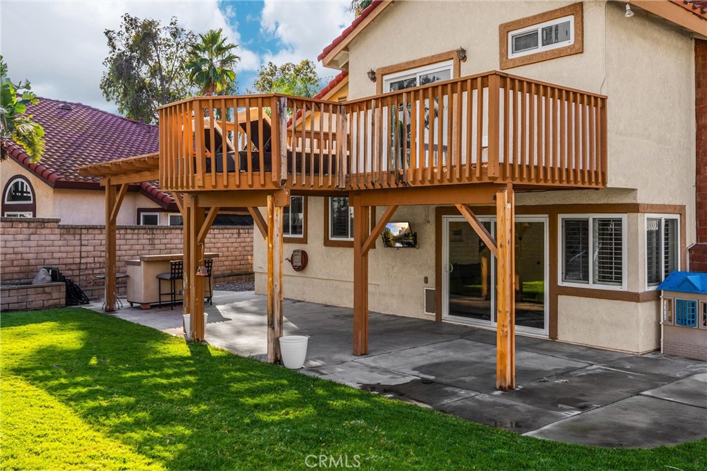 7077 Campbell Place Rancho Cucamonga, CA 91701 - Photo 47 of 74 a view of a house with a yard balcony and a slide