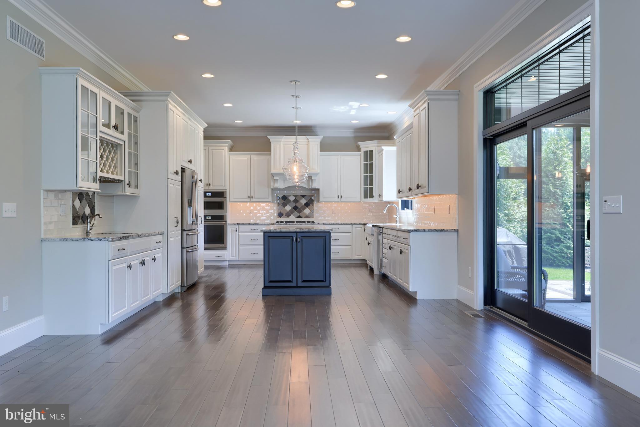 428 Southampton Drive Lititz, PA 17543 - Photo 24 of 60 a large kitchen with stainless steel appliances wooden floors and view living room