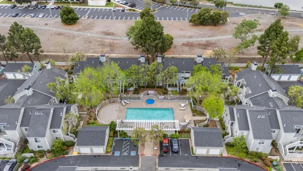 an aerial view of a house with yard swimming pool and outdoor seating