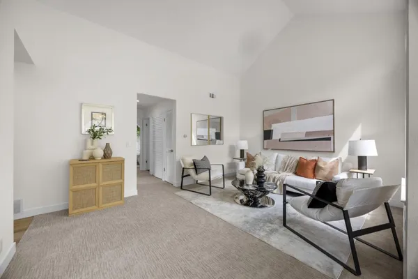 a living room with furniture and a table