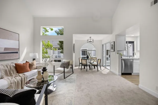 a living room with furniture and a table
