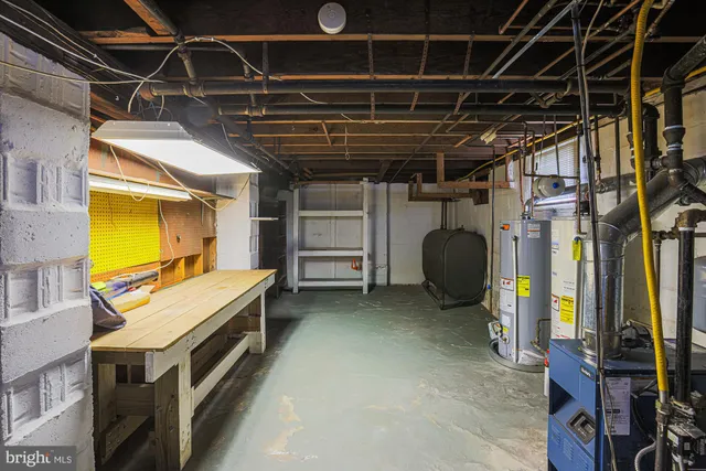 a white toilet sitting next to a white sink