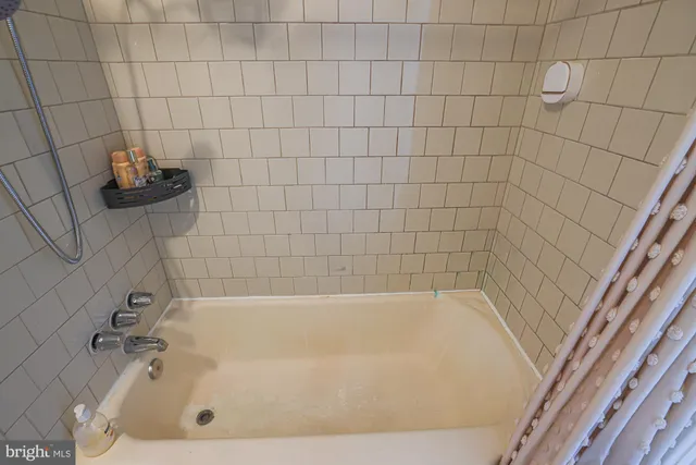 a kitchen with a sink appliances and cabinets