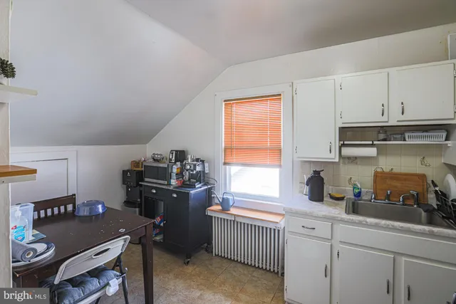 a kitchen with a stove and a refrigerator