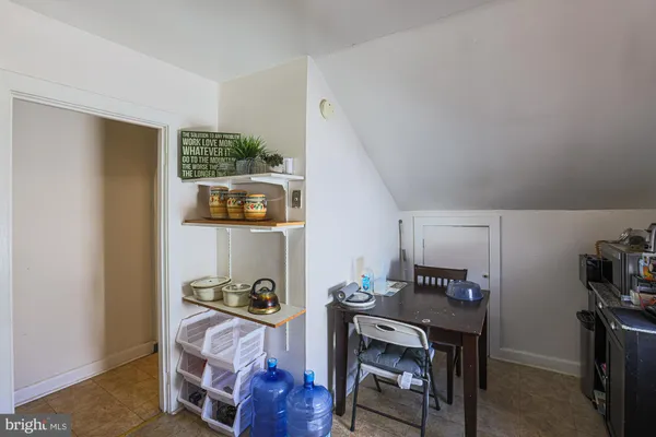 an entryway with wooden floor and door