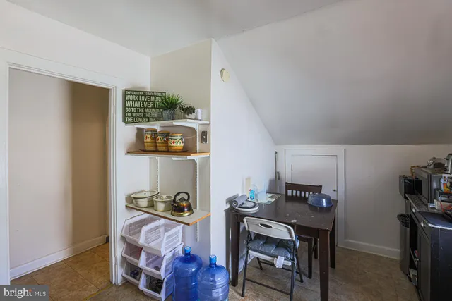 an entryway with wooden floor and door