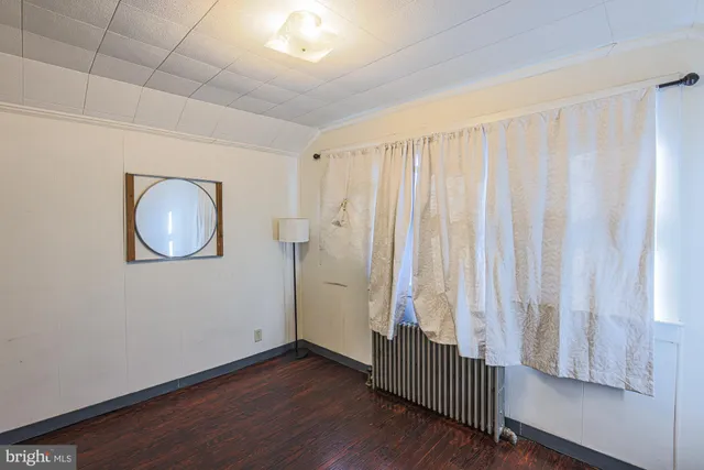 a bedroom with a bed and a desk