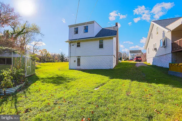 a view of front of house with a yard