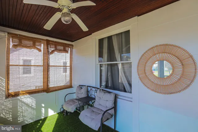 a view of an entryway with wooden floor