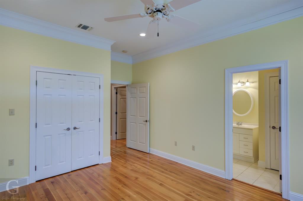 1212 WPA Road Homer, LA 71040 - Photo 14 of 35 Unfurnished bedroom featuring ornamental molding, light wood finished floors, a sink, baseboards, and a closet