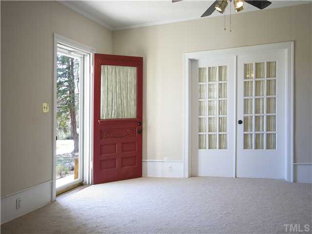 12700 School House Road Middlesex, NC 27557 - Photo 18 of 25 Beautiful carved front door and French doors to master bedroom are some of the wonderful historically-based architectural details found in this home.