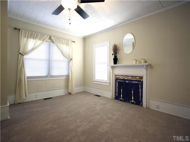 12700 School House Road Middlesex, NC 27557 - Photo 19 of 25 Master bedroom also has a decorative (non-working) fireplace. Celing fan with light. New carpet. Lots of windows to bring in the natural light. Master bedroom has its own bath.