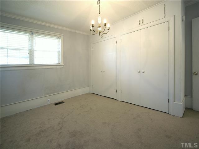 12700 School House Road Middlesex, NC 27557 - Photo 20 of 25 The home has three bedrooms. All are spacious. All have brand new carpet. Both of the secondary bedrooms feature dual closets. This bedroom at the back of the home would also make a great home office, media room, or music room.
