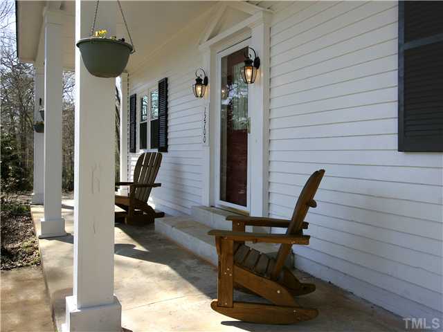 12700 School House Road Middlesex, NC 27557 - Photo 3 of 25 The large, covered, rocking-chair-style front porch is a perfect place to relax and enjoy the temperate North Carolina weather.