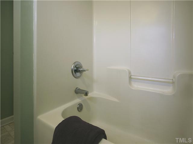 12700 School House Road Middlesex, NC 27557 - Photo 22 of 25 Hall bath has easy-clean tub/shower with one-piece surround.