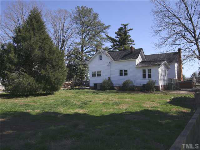 12700 School House Road Middlesex, NC 27557 - Photo 6 of 25 Back yard has large level fenced area--perfect for play or pets. Mature landscaping with many large hardwood trees and firs. A nice mix of sun and shade.