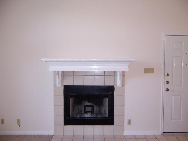 Undisclosed Address Austin, TX 78729 - Photo 4 of 5 a room with a fireplace