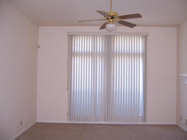 Undisclosed Address Austin, TX 78729 - Photo 5 of 5 a view of a livingroom with a ceiling fan and window