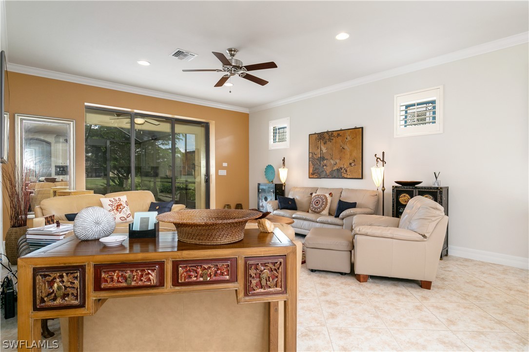 10922 Dennington Road Fort Myers, FL 33913 - Photo 17 of 35 a living room with furniture and a window