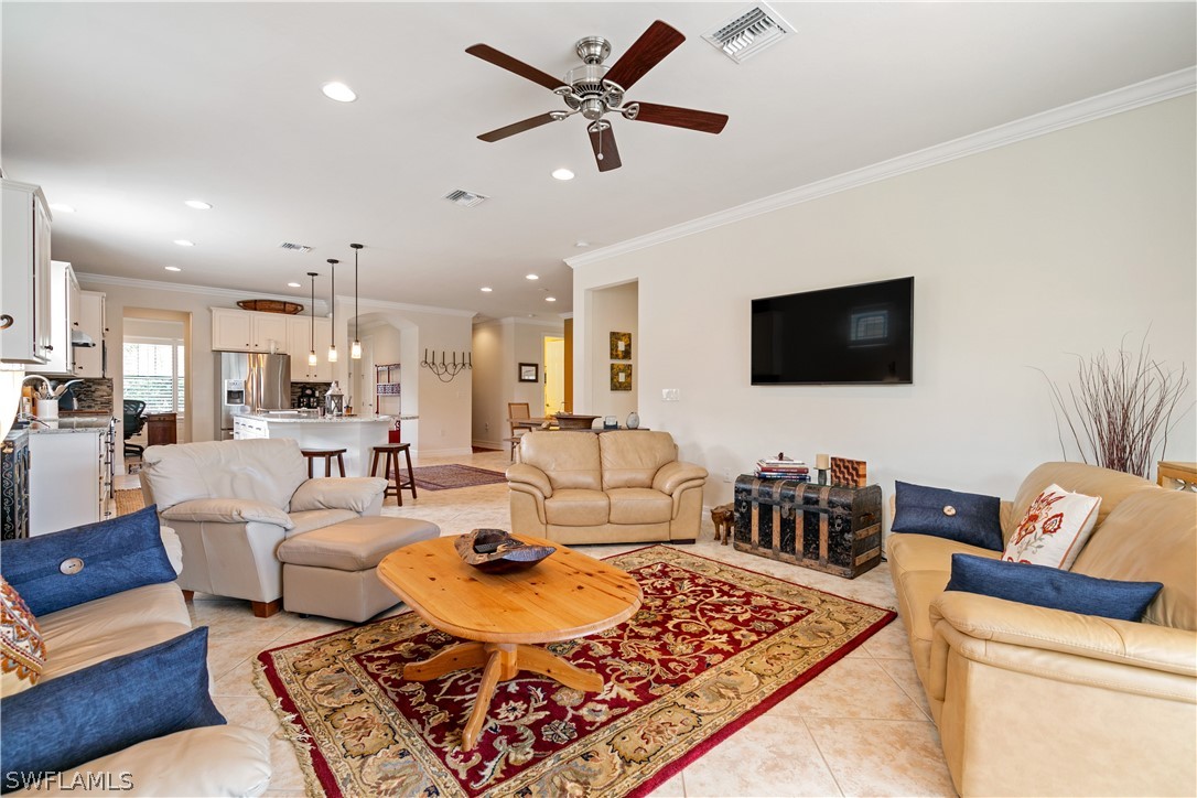 10922 Dennington Road Fort Myers, FL 33913 - Photo 18 of 35 a living room with furniture and a flat screen tv