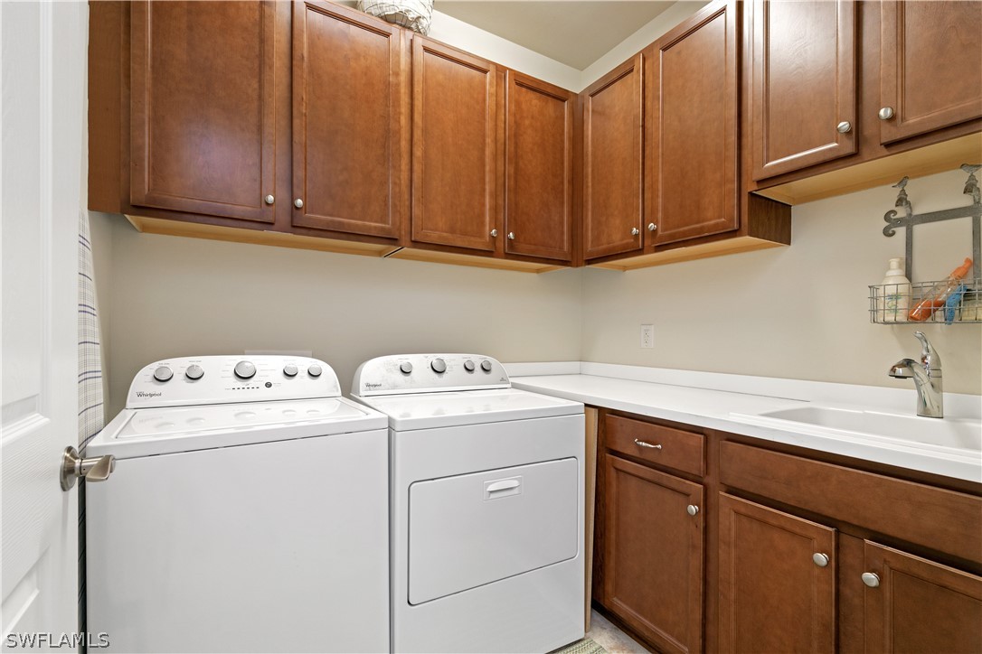 10922 Dennington Road Fort Myers, FL 33913 - Photo 19 of 35 a utility room with dryer and washer