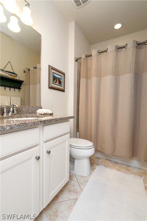 10922 Dennington Road Fort Myers, FL 33913 - Photo 26 of 35 a bathroom with a sink a toilet and a mirror