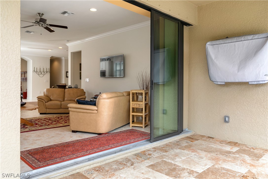 10922 Dennington Road Fort Myers, FL 33913 - Photo 28 of 35 a living room with furniture and a rug