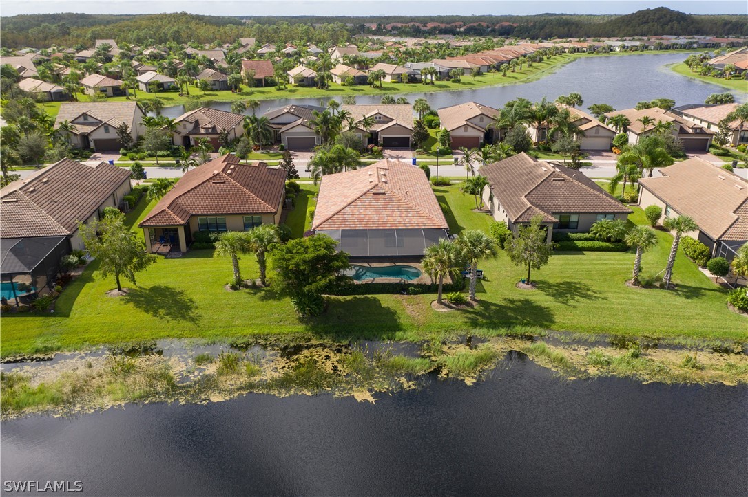 10922 Dennington Road Fort Myers, FL 33913 - Photo 32 of 35 an aerial view of residential houses with outdoor space and river