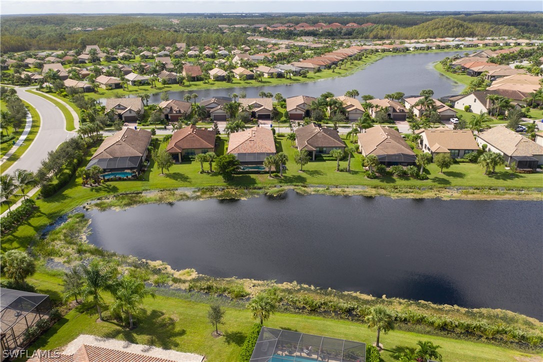 10922 Dennington Road Fort Myers, FL 33913 - Photo 33 of 35 an aerial view of residential houses with outdoor space and river