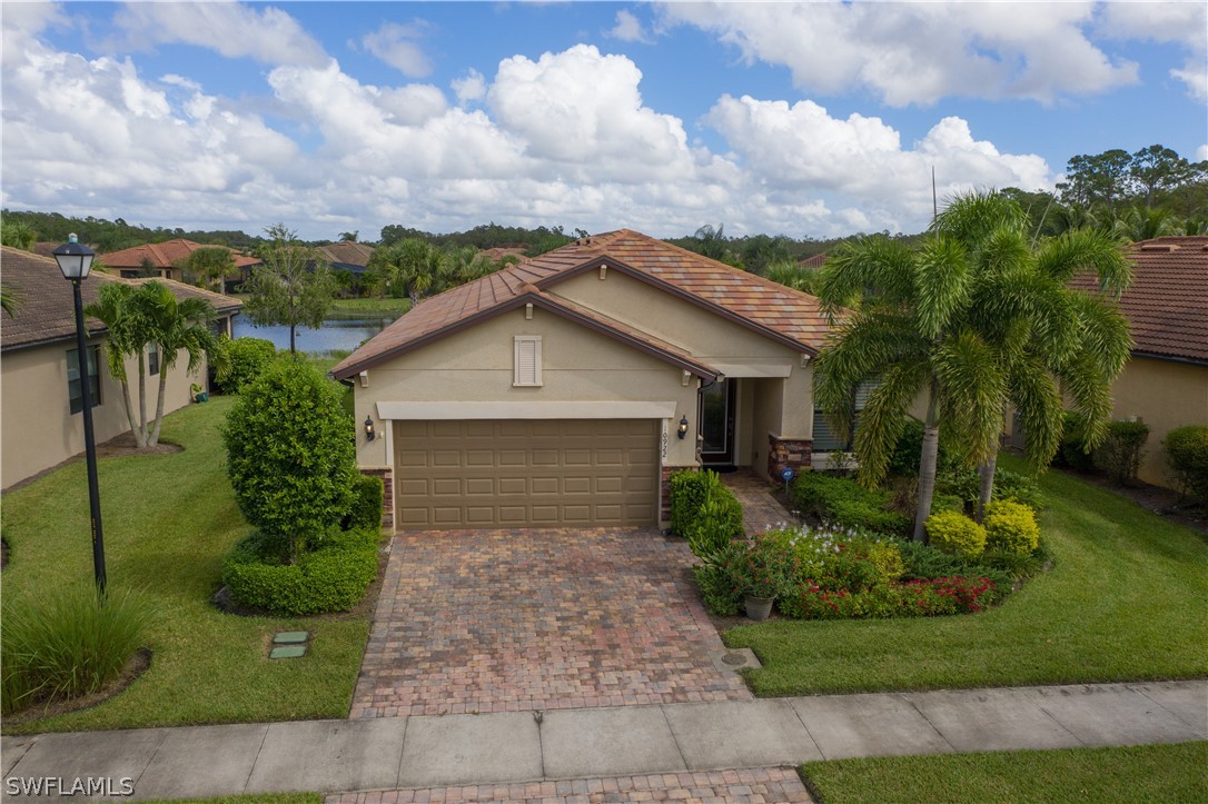 10922 Dennington Road Fort Myers, FL 33913 - Photo 34 of 35 a front view of a house with garden