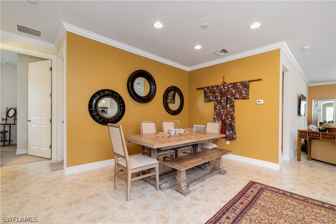 10922 Dennington Road Fort Myers, FL 33913 - Photo 9 of 35 a view of a dining room with furniture and wooden floor