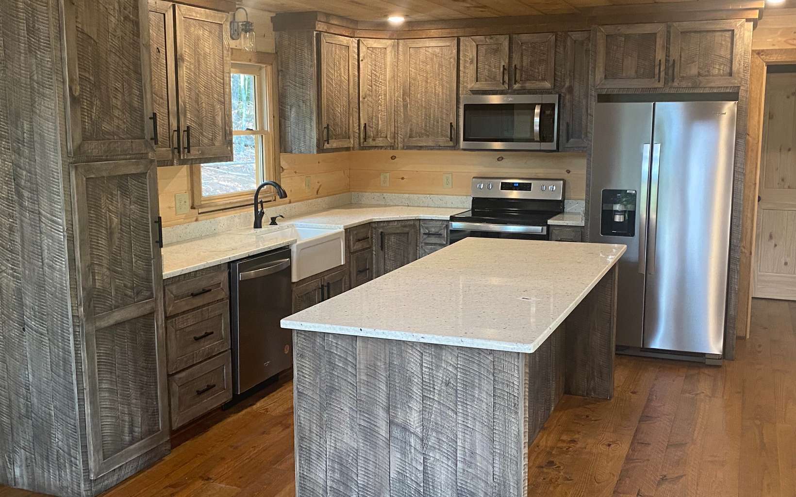 58 Papa Bear Path Cherry Log, GA 30522 - Photo 14 of 33 a kitchen with a sink a microwave a refrigerator and cabinets