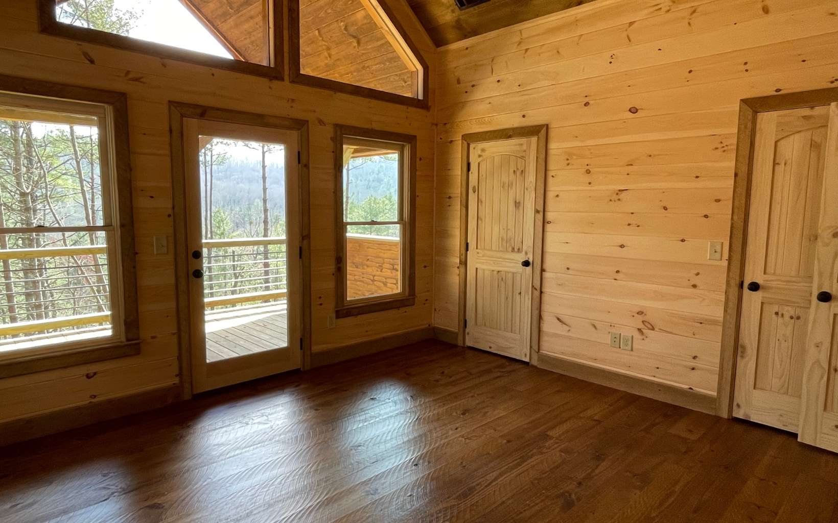 58 Papa Bear Path Cherry Log, GA 30522 - Photo 22 of 33 an empty room with wooden floor and windows