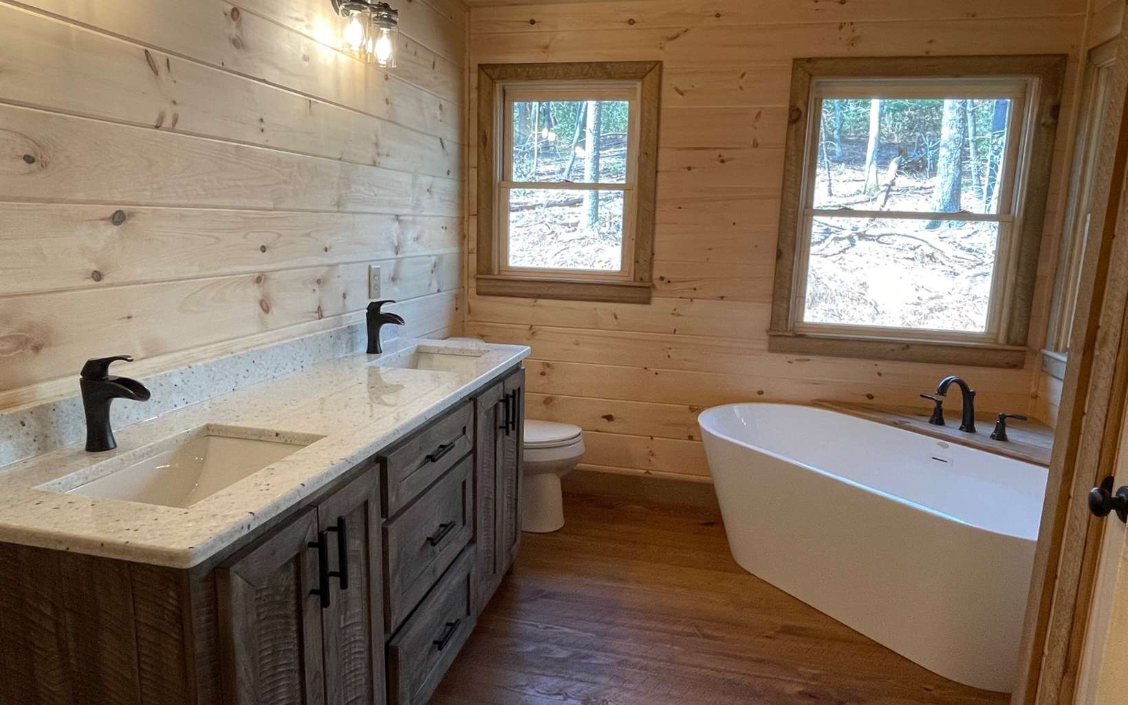58 Papa Bear Path Cherry Log, GA 30522 - Photo 25 of 33 a bathroom with a granite countertop sink and a bathtub