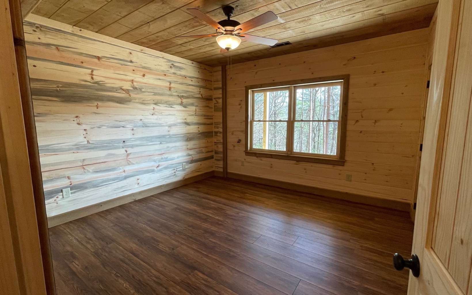 58 Papa Bear Path Cherry Log, GA 30522 - Photo 29 of 33 a view of empty room with wooden floor and fan
