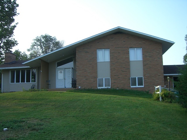 2778 Freeport Road Rockton, IL 61072 - Photo 1 of 4 a brick house with a yard