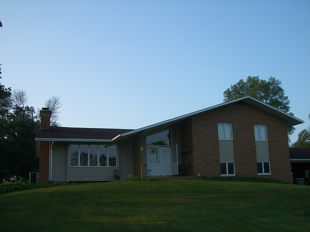 2778 Freeport Road Rockton, IL 61072 - Photo 2 of 4 a front view of a house with a garden