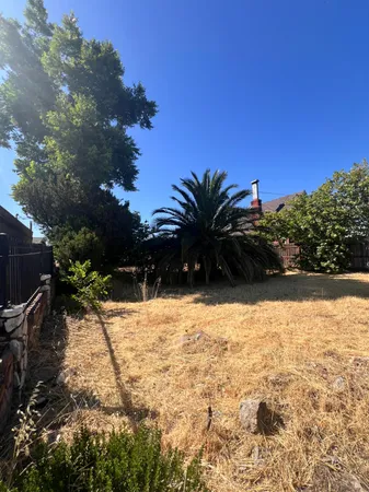 a view of backyard with outdoor space