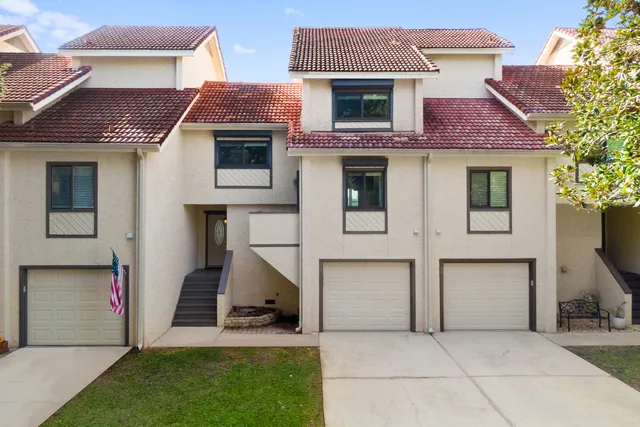 an aerial view of a house with a yard and garden