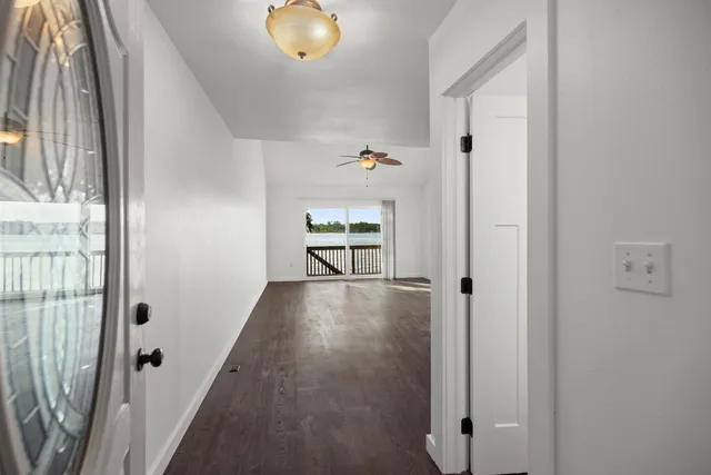 a kitchen with sink and refrigerator