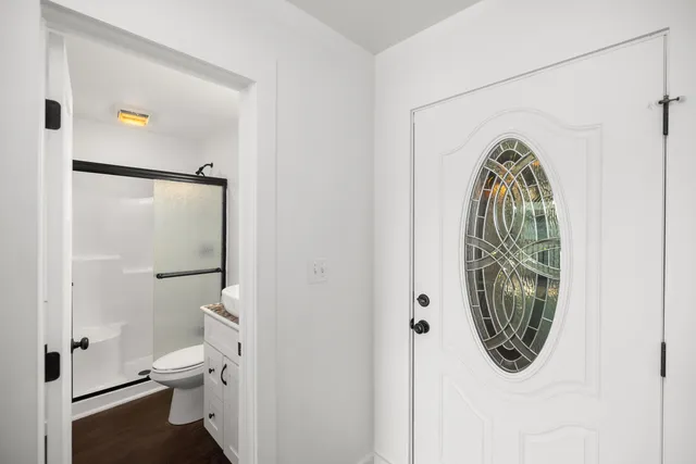 a kitchen with granite countertop a stove and a sink