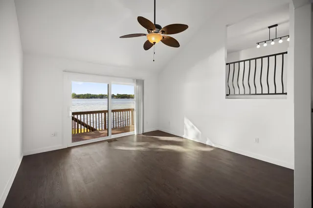 a kitchen with white cabinets and appliances