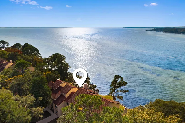 a view of a swimming pool with a house in the background