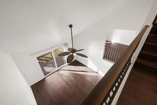 a view of a lake with boats and trees in the background