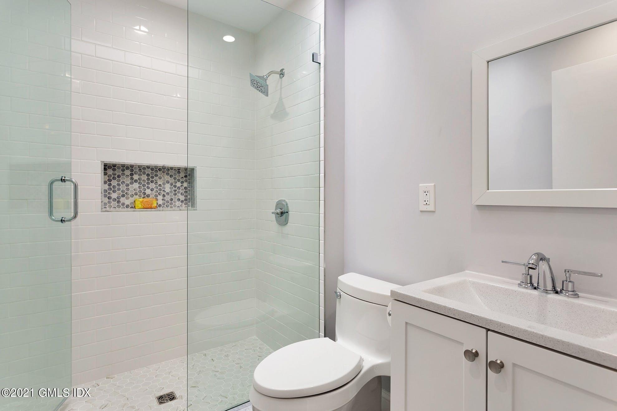 7 Chateau Ridge Road Greenwich, CT 06831 - Photo 15 of 36 a bathroom with a sink toilet and shower