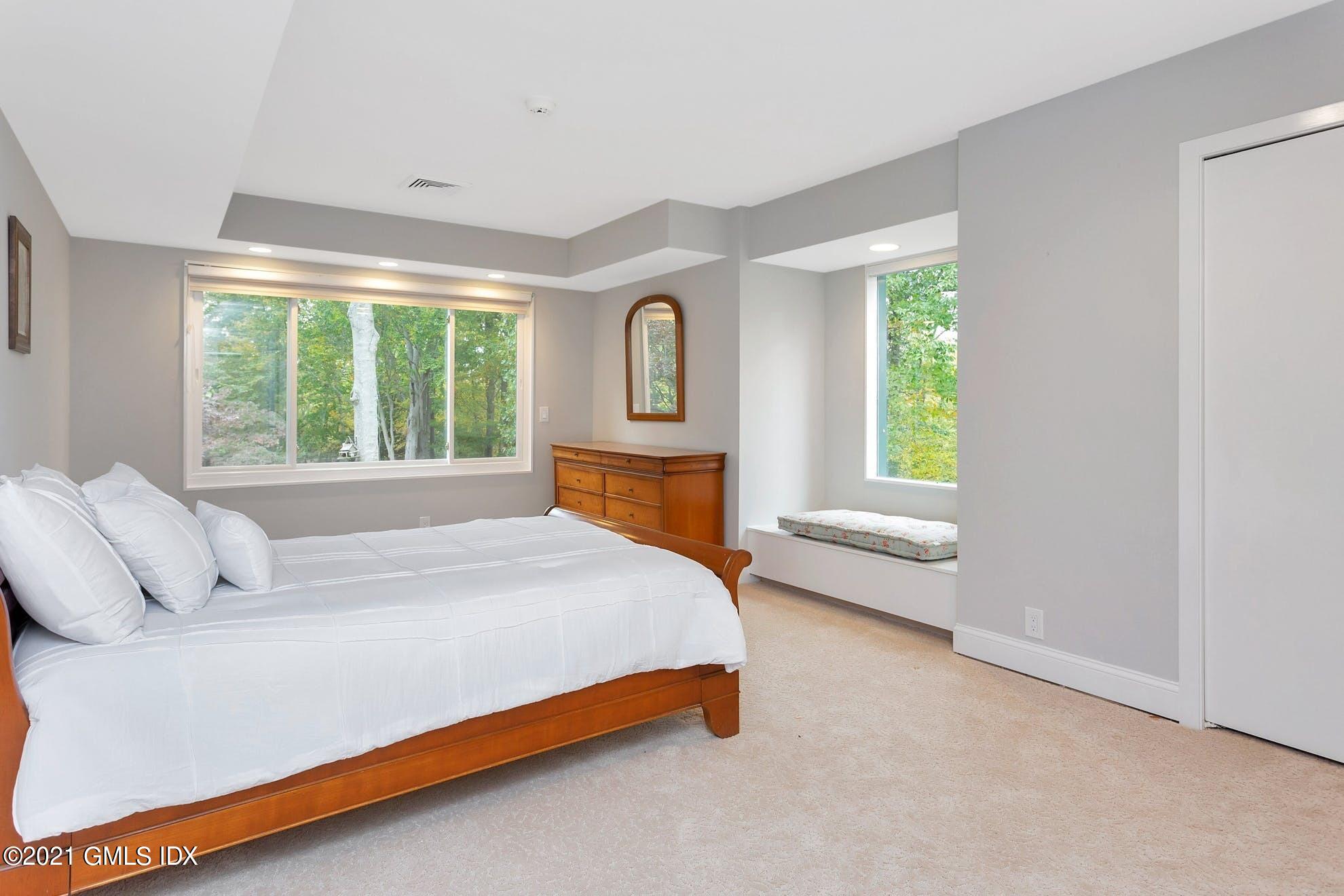 7 Chateau Ridge Road Greenwich, CT 06831 - Photo 16 of 36 a bedroom with a bed and window