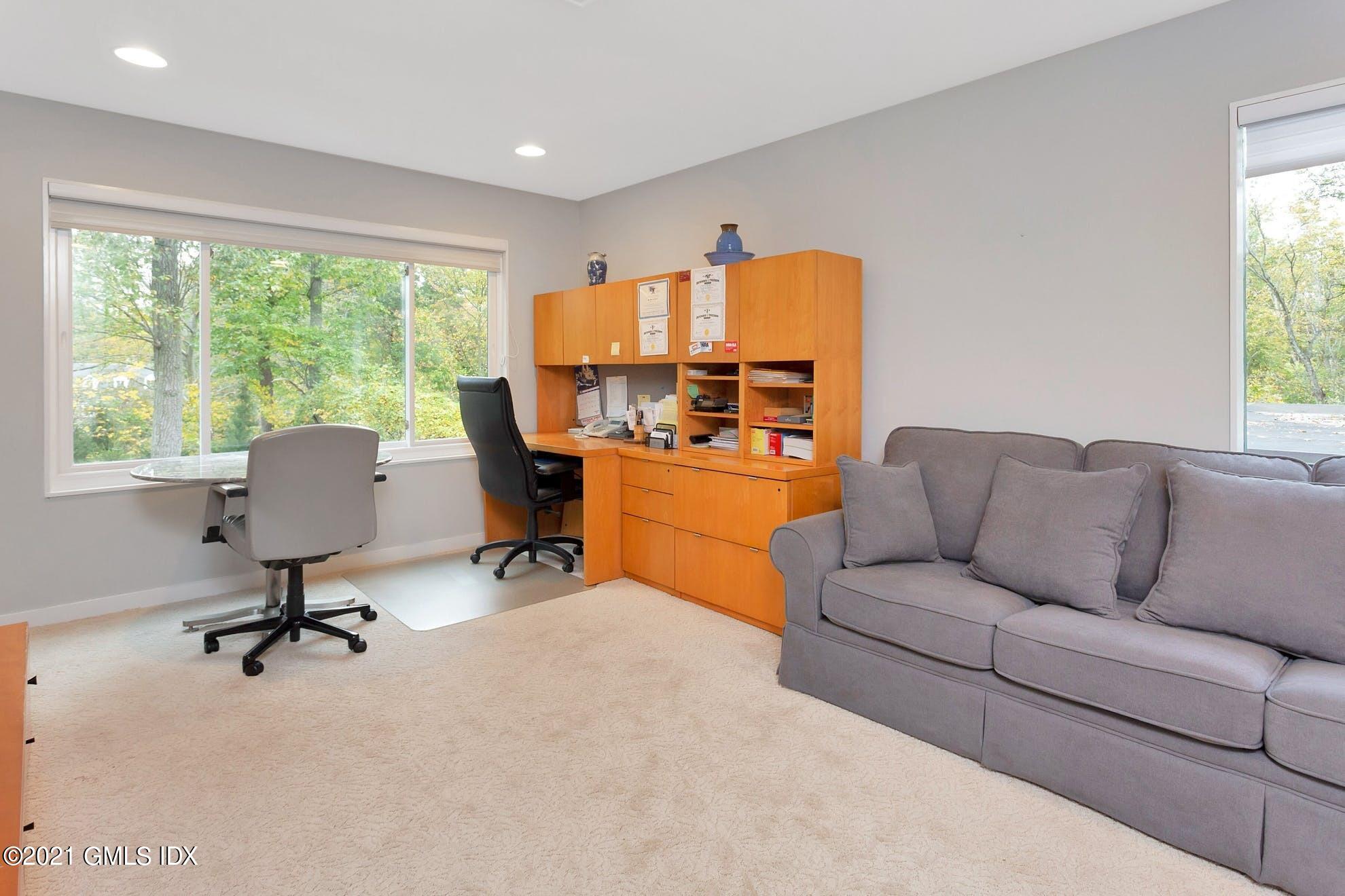 7 Chateau Ridge Road Greenwich, CT 06831 - Photo 18 of 36 a living room with furniture and a window