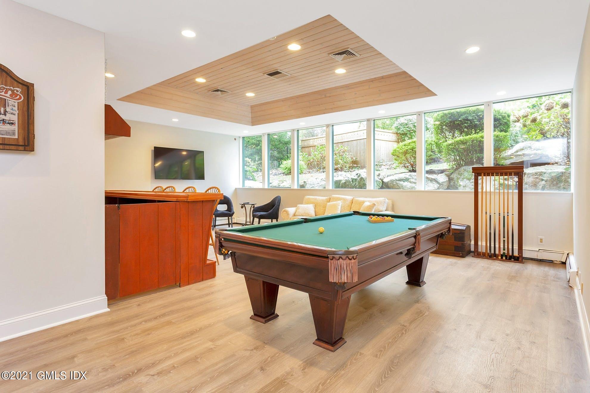 7 Chateau Ridge Road Greenwich, CT 06831 - Photo 19 of 36 a room with pool table and windows