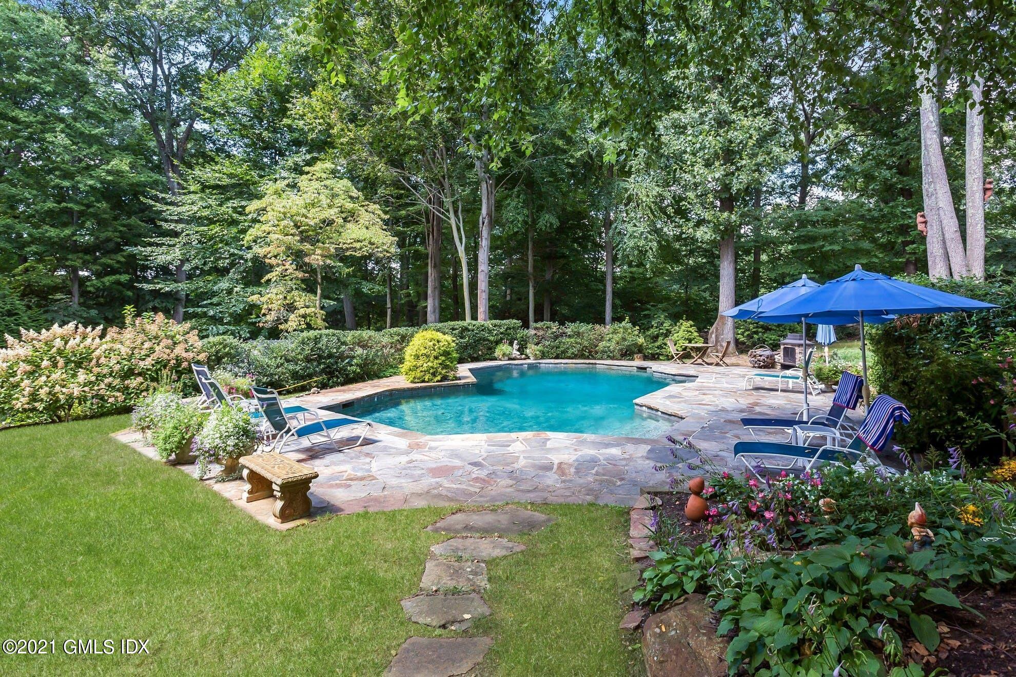 7 Chateau Ridge Road Greenwich, CT 06831 - Photo 2 of 36 a view of a garden with an outdoor space